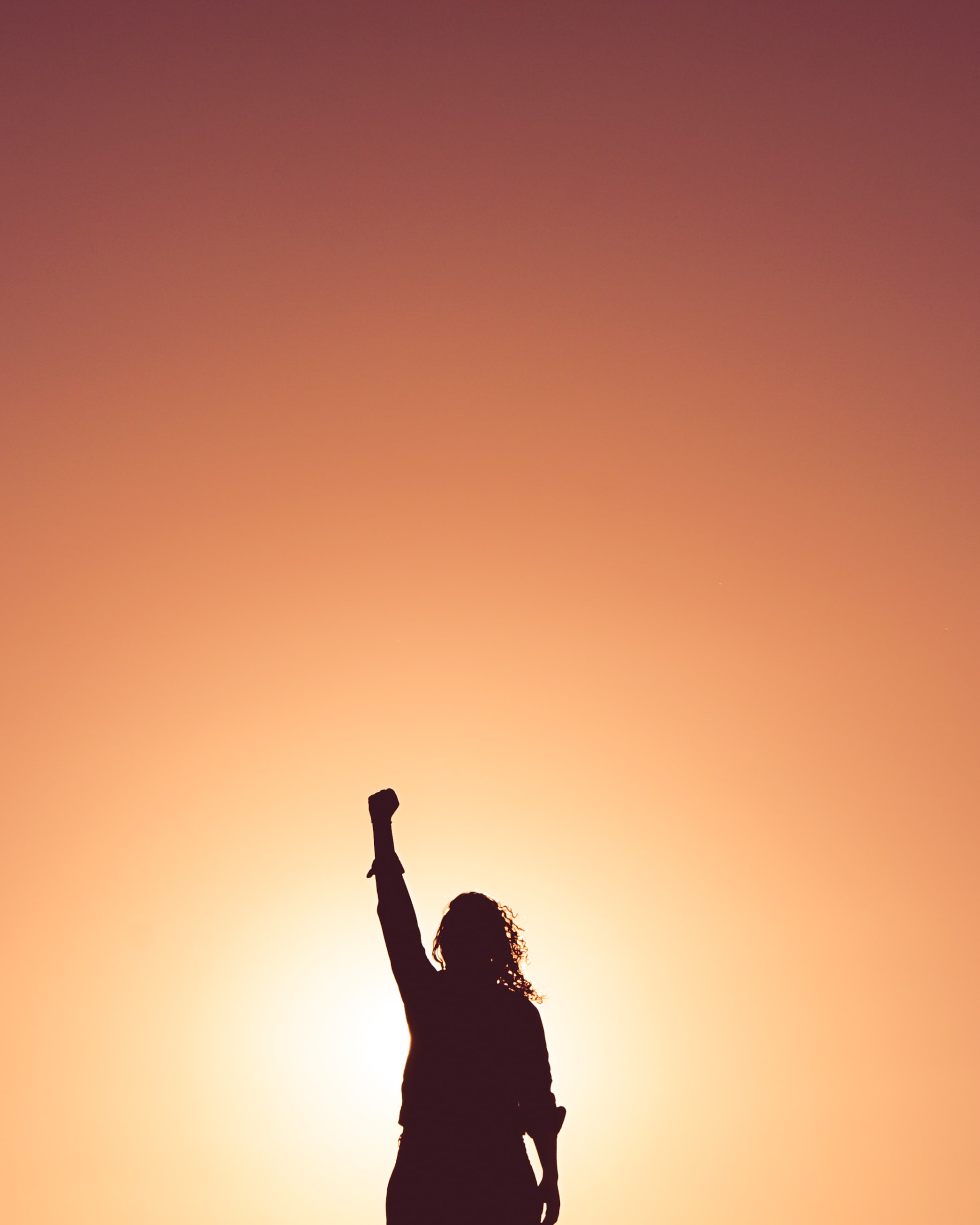 Image of girl with fist up.Photo by Miguel Bruna